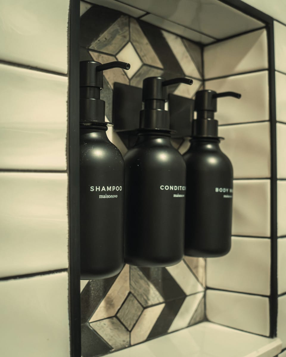 Sleek shower niche with refillable shampoo, conditioner & body wash