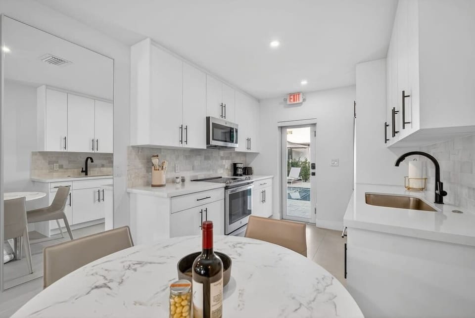 Enjoy easy access from the dining area to the kitchen, with a door that opens straight onto the pool deck.