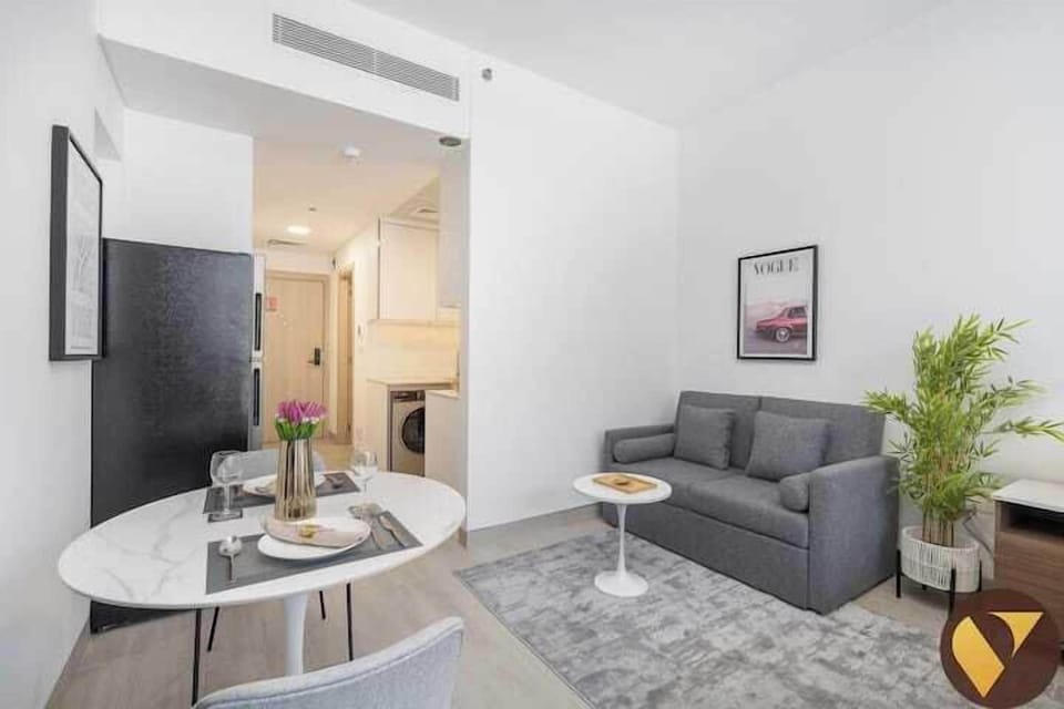 Luxury Studio, Balcony, City View | Living area | 65-inch Smart TV with cable channels