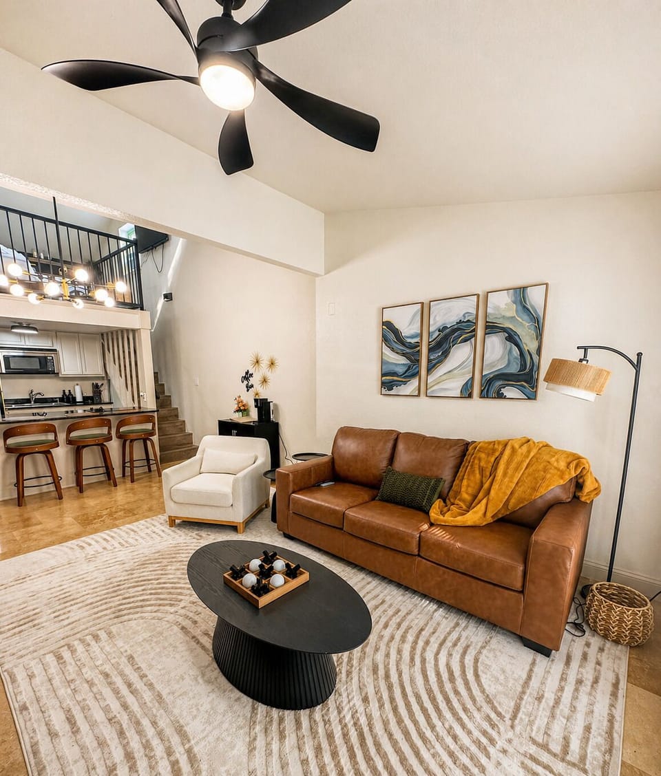 Open concept living room with queen sofa bed.