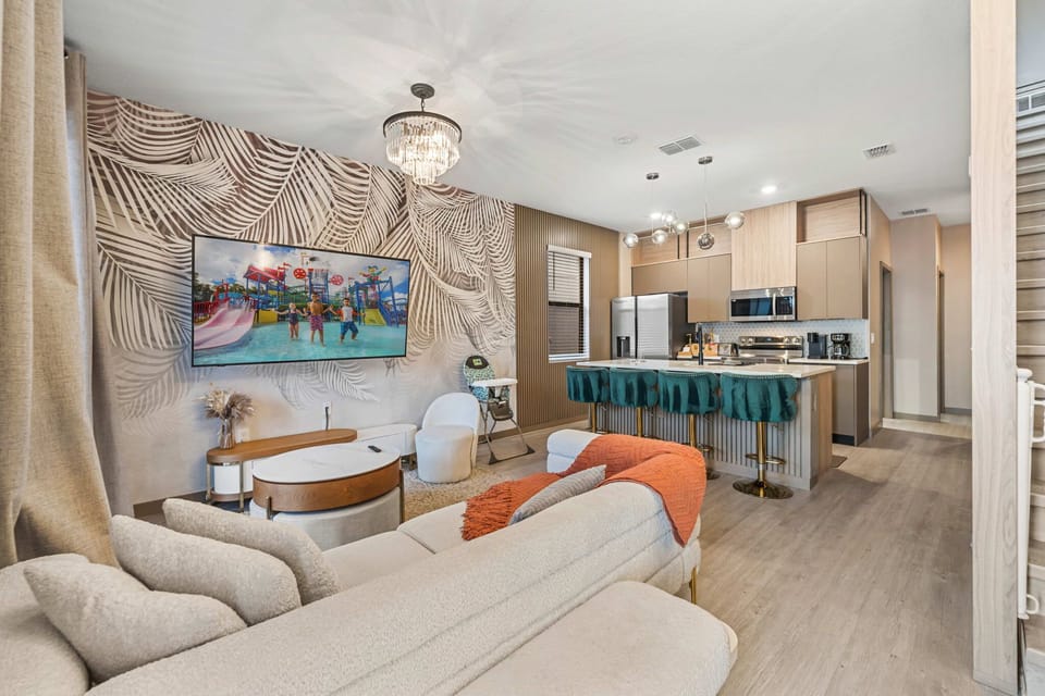 Modern open-concept living area with a stylish kitchen island and comfortable seating.