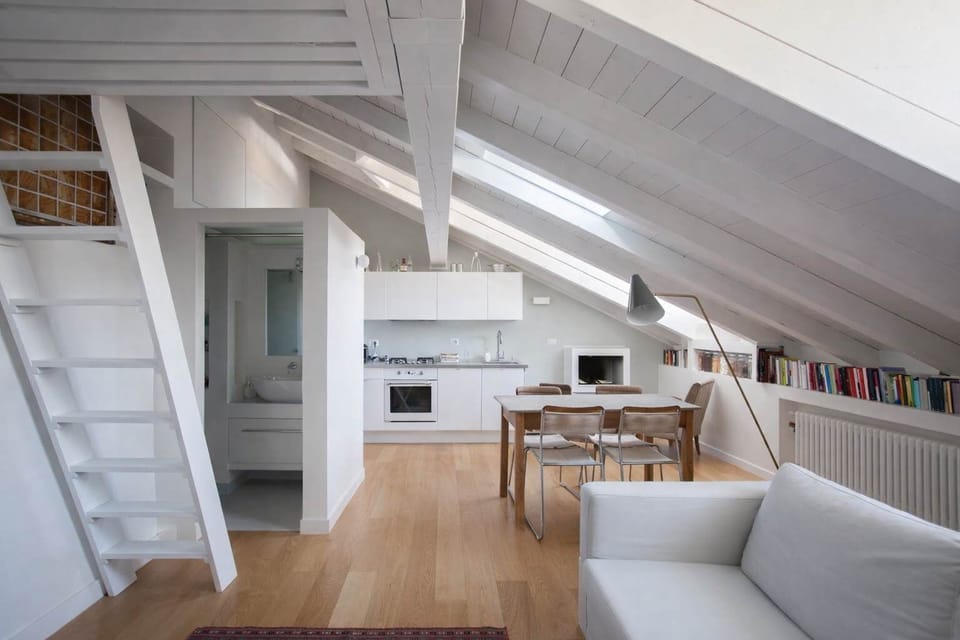 Space with a comfortable white sofa, blending warmth, design, and comfort.