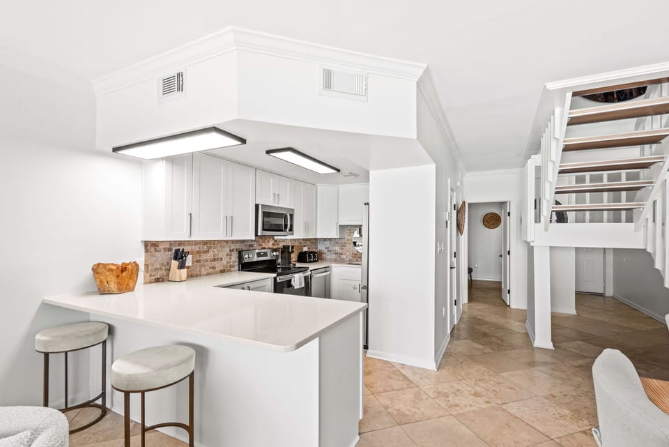 Fully equipped kitchen in gulf front 30A townhome. Steps to pool and beach. 