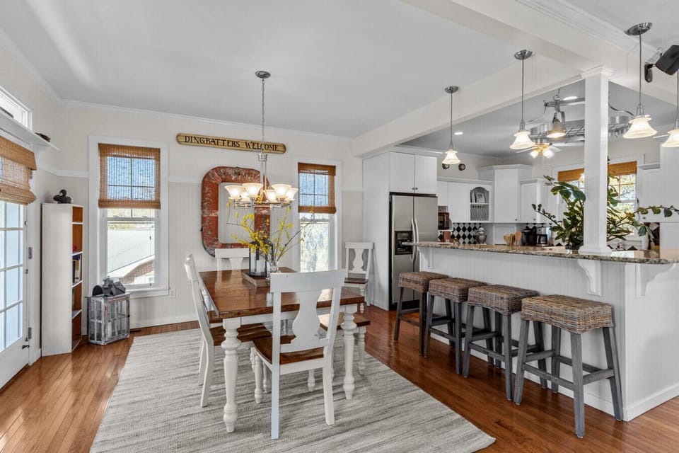 Enjoy shared meals at the dining table with easy access to the open kitchen and bar seating
