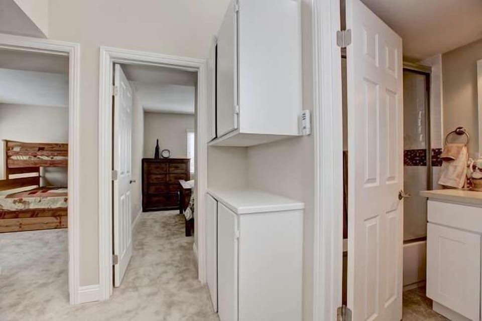 Upper level view of the bathroom and 2 bedrooms from the master bedroom.