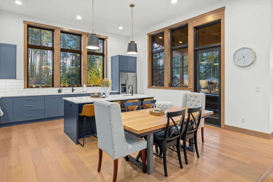 Spacious chef’s kitchen with large island and dining area for shared meals.