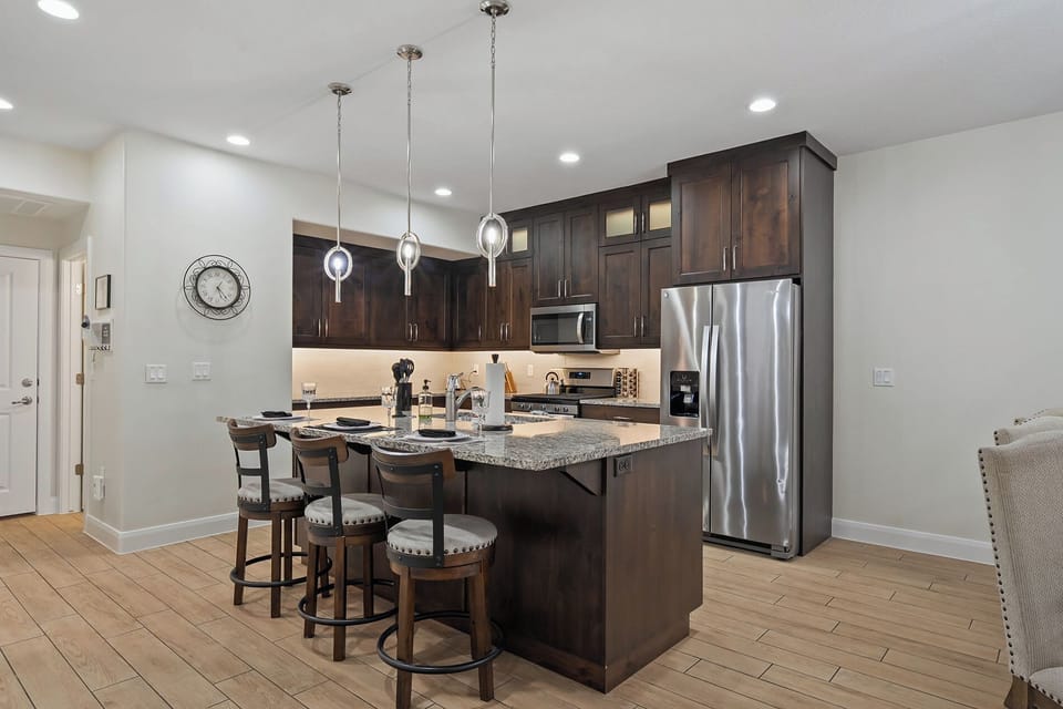 Breakfast bar seating connecting kitchen and living area