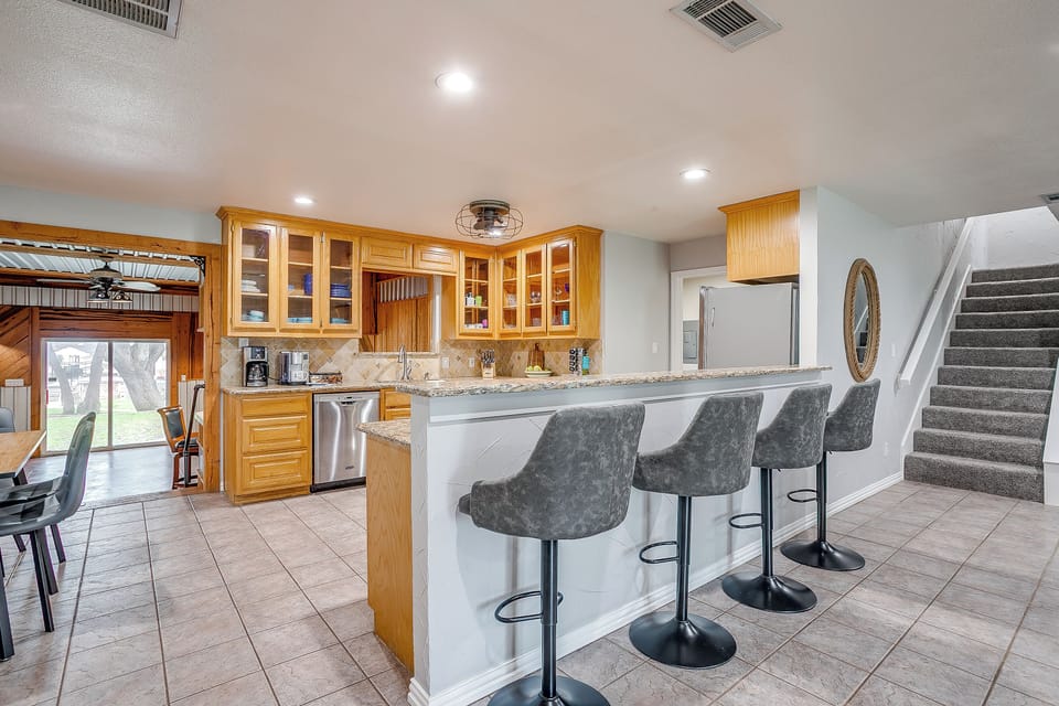 Cook, chat, and sip coffee at the kitchen island with seating for four