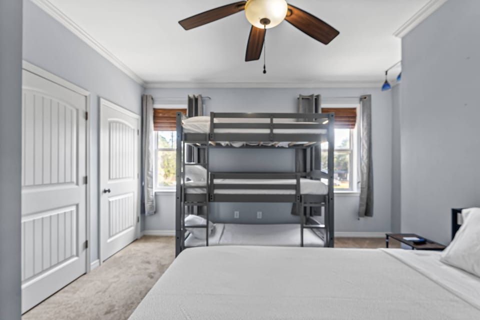 Kid friendly bunk room with triple bunk beds