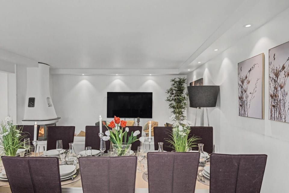 Dining table positioned within the open-plan living room and kitchen layout.