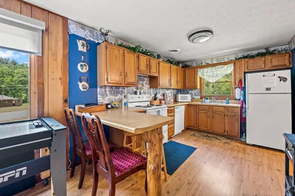 Prepare meals with ease in the fully equipped kitchen. Plenty of counter space and a nearby dining table make it simple to gather everyone together for breakfast or dinner.