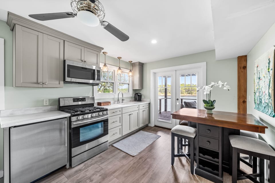 A fully equipped and modern kitchen featuring stainless steel appliances