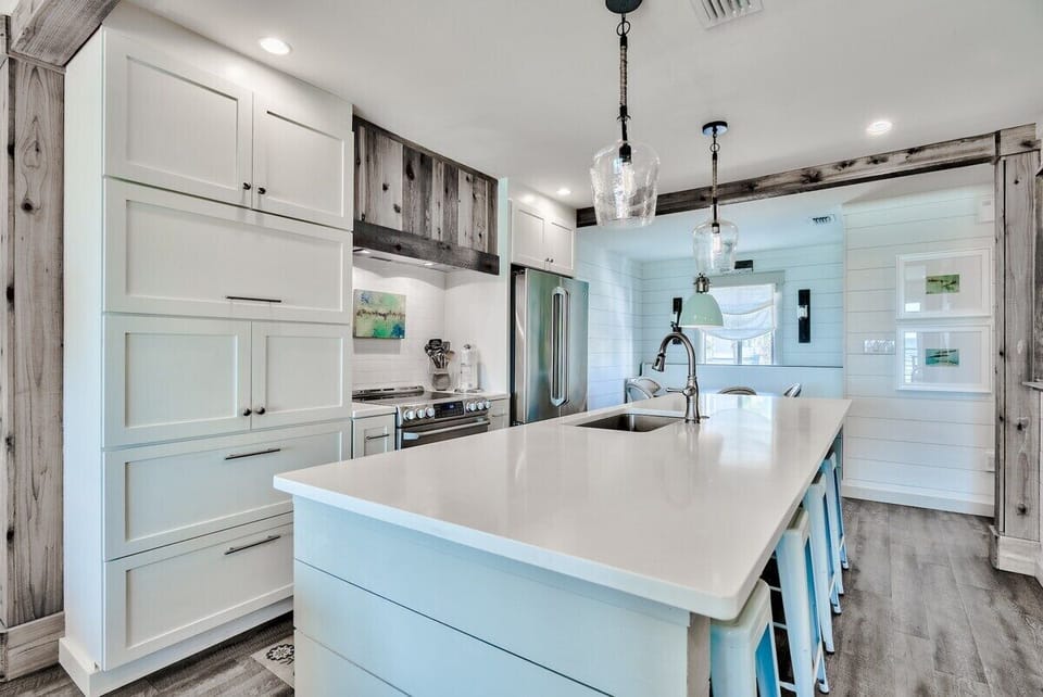 Well-equipped kitchen and big island with seating.