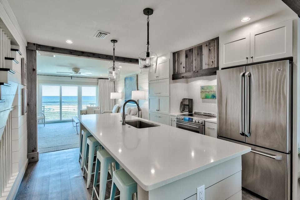 A Chef's Kitchen - Plenty of space to cook a gourmet meal and serve your family at the big island while looking at the beach.