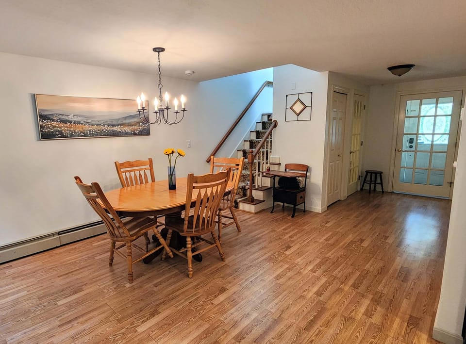 Main Level Dining area with seating for 4 and a few extra chairs are available.