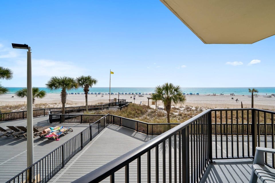 Enjoy your private balcony overlooking the emerald waters and sugar-white sand.