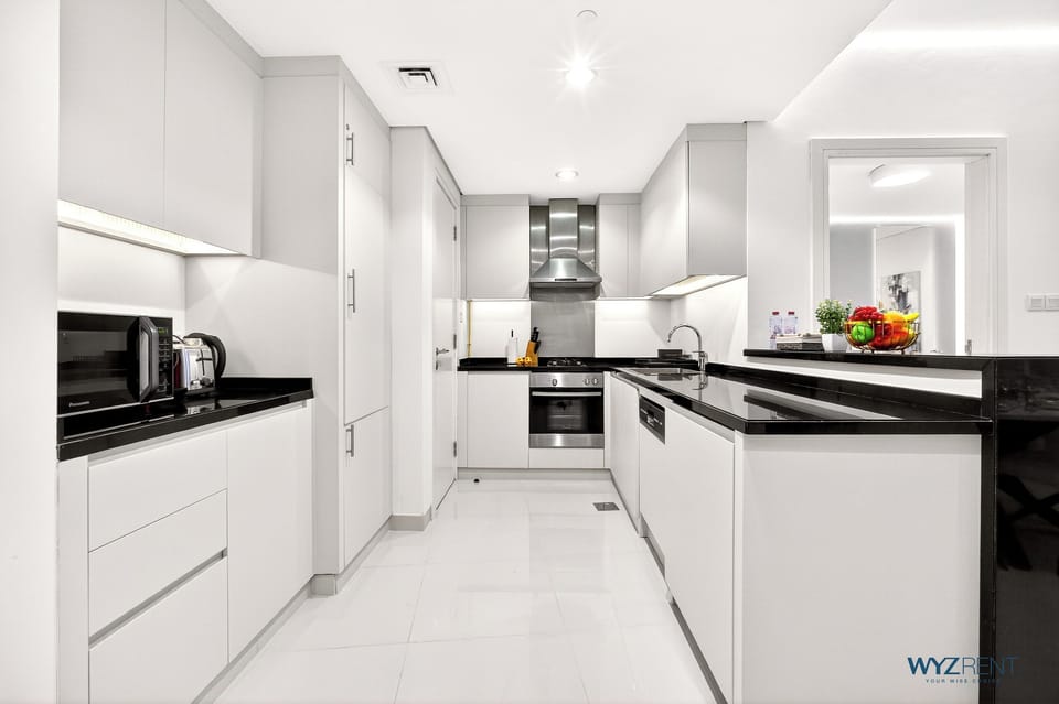 Apartment, Pool View | Private kitchen | Coffee/tea maker