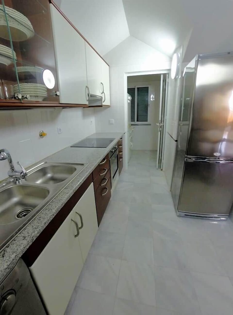 Separate laundry room next to the kitchen