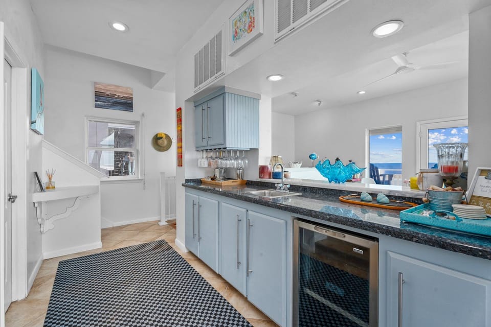 Modern kitchen with bar seating, ample counter space, and open layout for entertaining.
