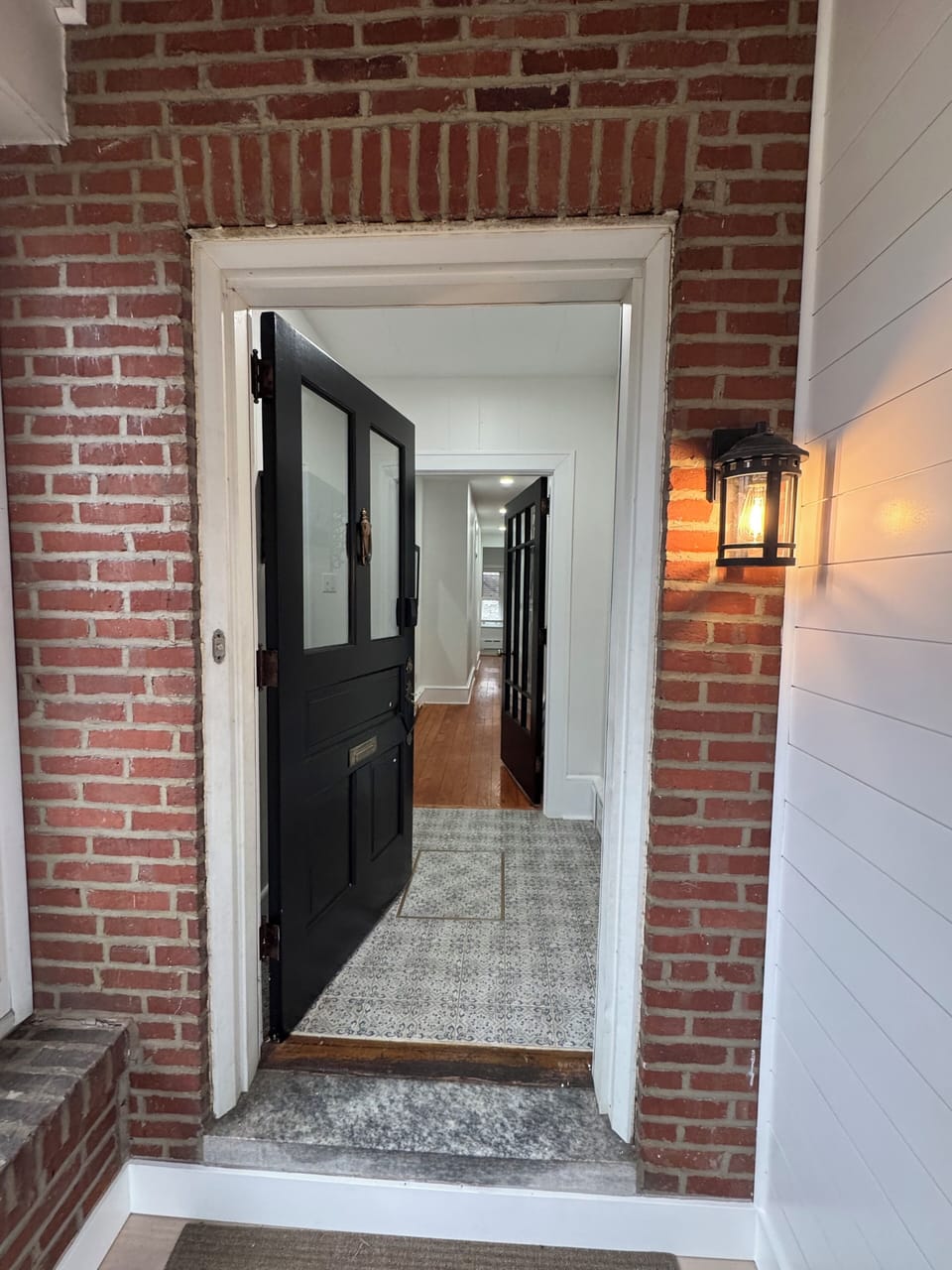 Bright, welcoming entryway with a view into the comfortable living space.