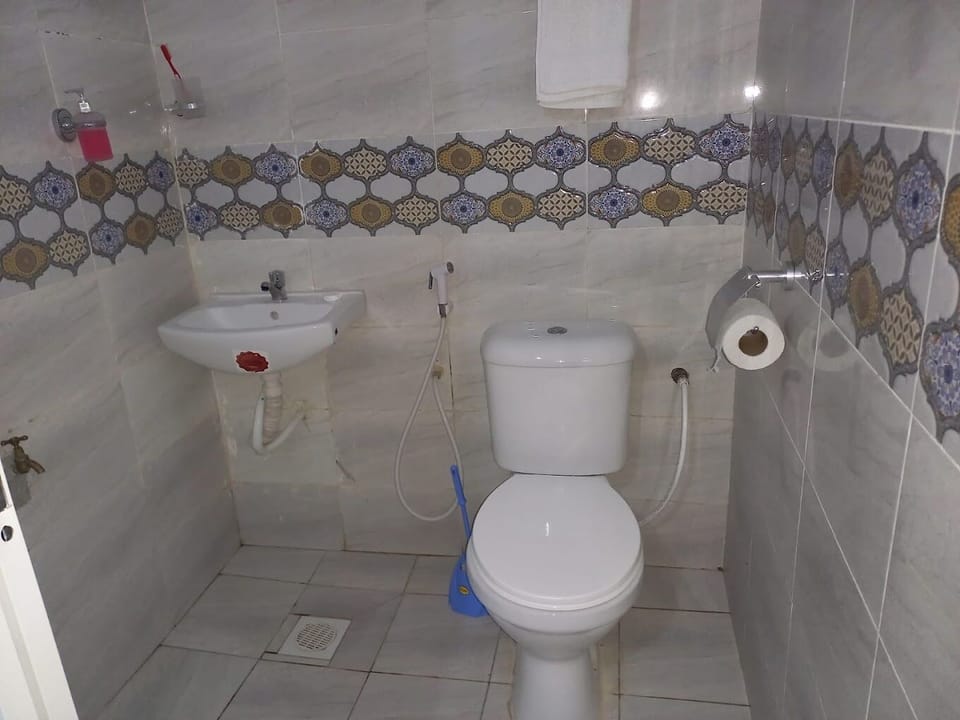 Deluxe Single Room | Bathroom | Shower, slippers, towels, soap