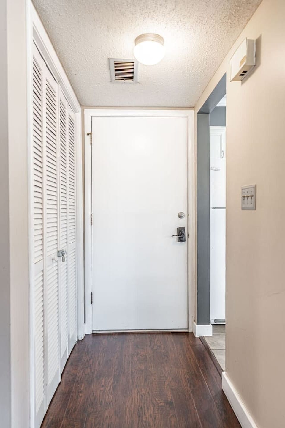 Welcoming entryway with convenient access to storage and the main living spaces.