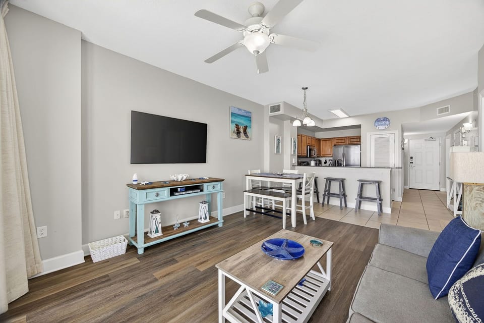 Relax in your bright, open living space with coastal touches and modern comfort for the perfect beach getaway.