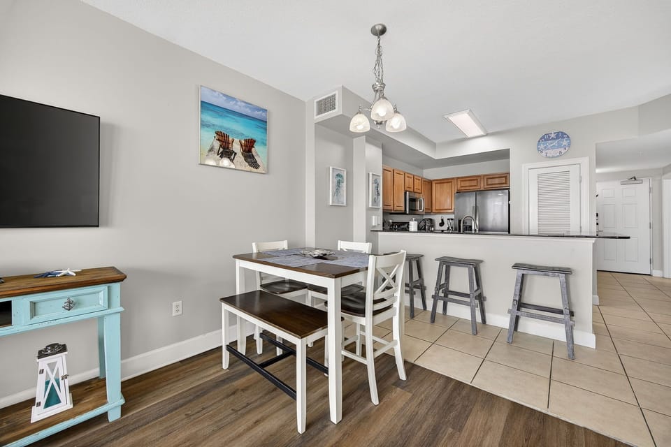 Your bright open-plan living space combines comfort and functionality with a fully equipped kitchen and cozy dining area for memorable meals together.