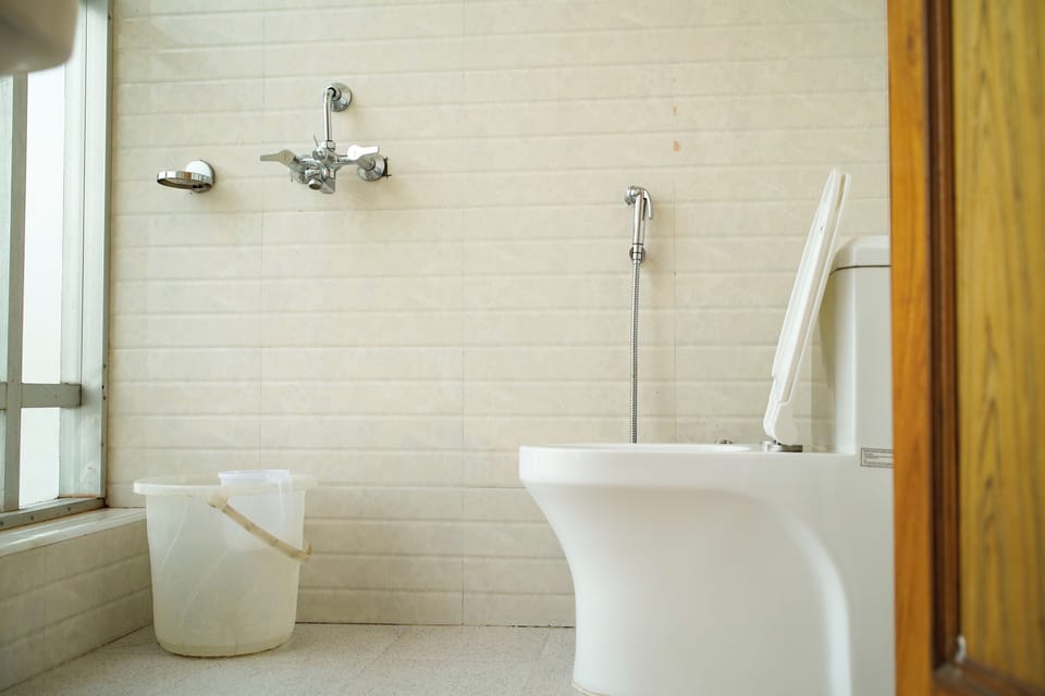 Deluxe Double Room, City View | Bathroom | Shower, slippers, towels, soap