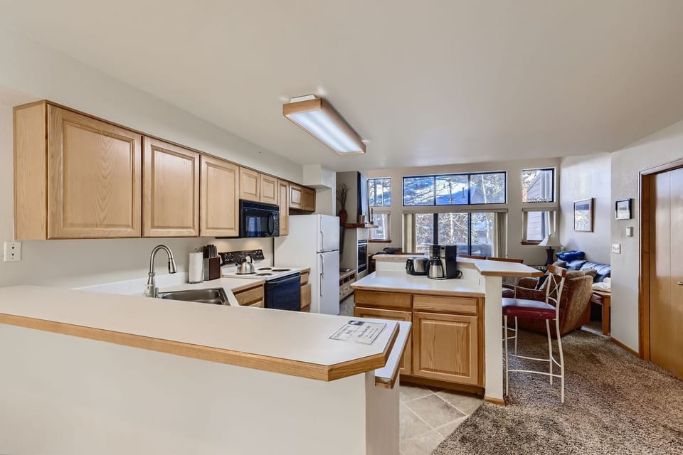 Your fully-equipped kitchen opens into a bright living space where you'll love cooking together and gathering around the breakfast bar.