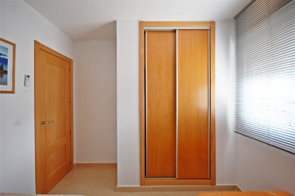 Bright, clean 2nd Bedroom with built-in storage, full mirror and natural light