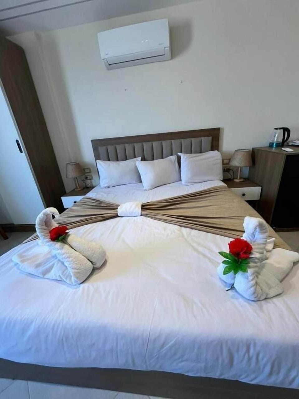 Deluxe Quadruple Room, City View | In-room safe, blackout drapes, soundproofing, iron/ironing board