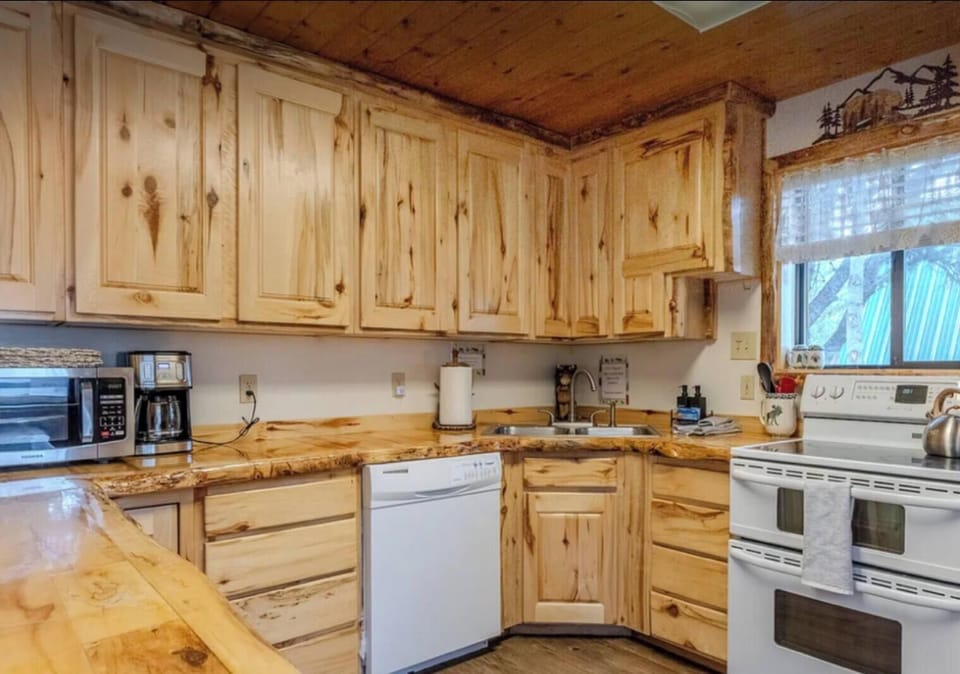 Full kitchen with dishwasher, stove, refrigerator microwave