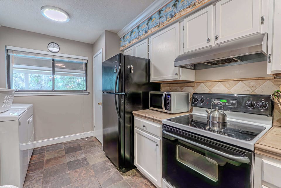 Fully equipped kitchen for preparing meals.