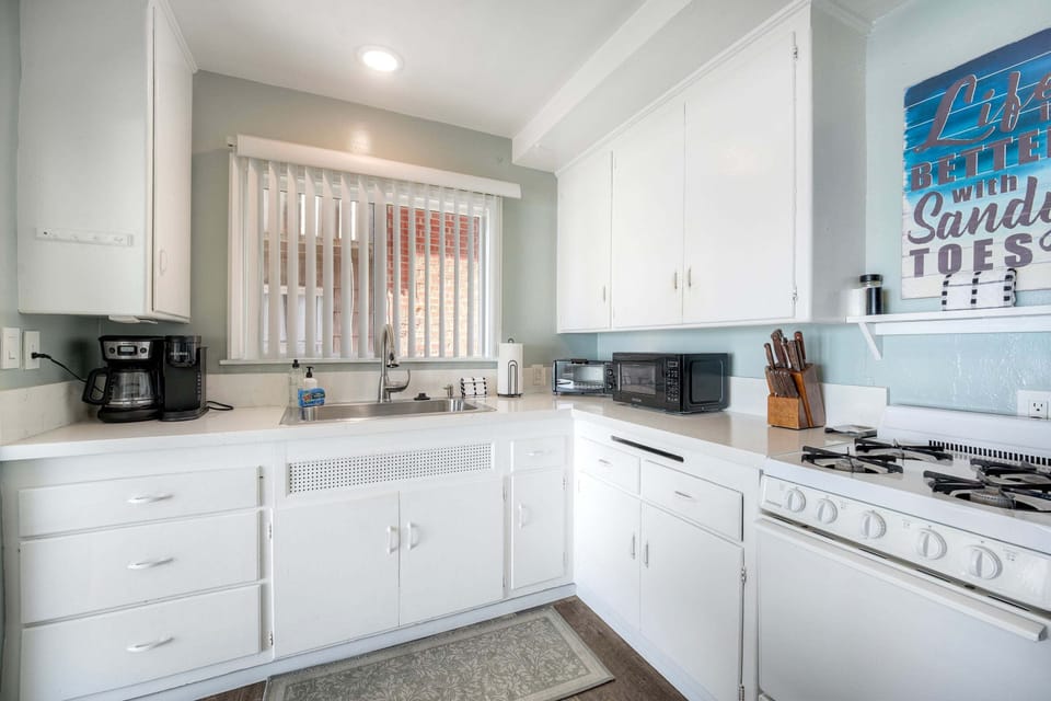 Coastal kitchen with coffee maker and essentials
