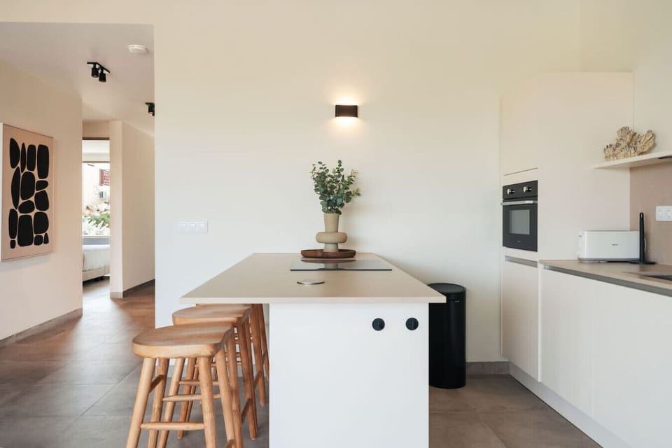 Modern kitchen with a breakfast bar and everything you need to prepare meals during your stay.