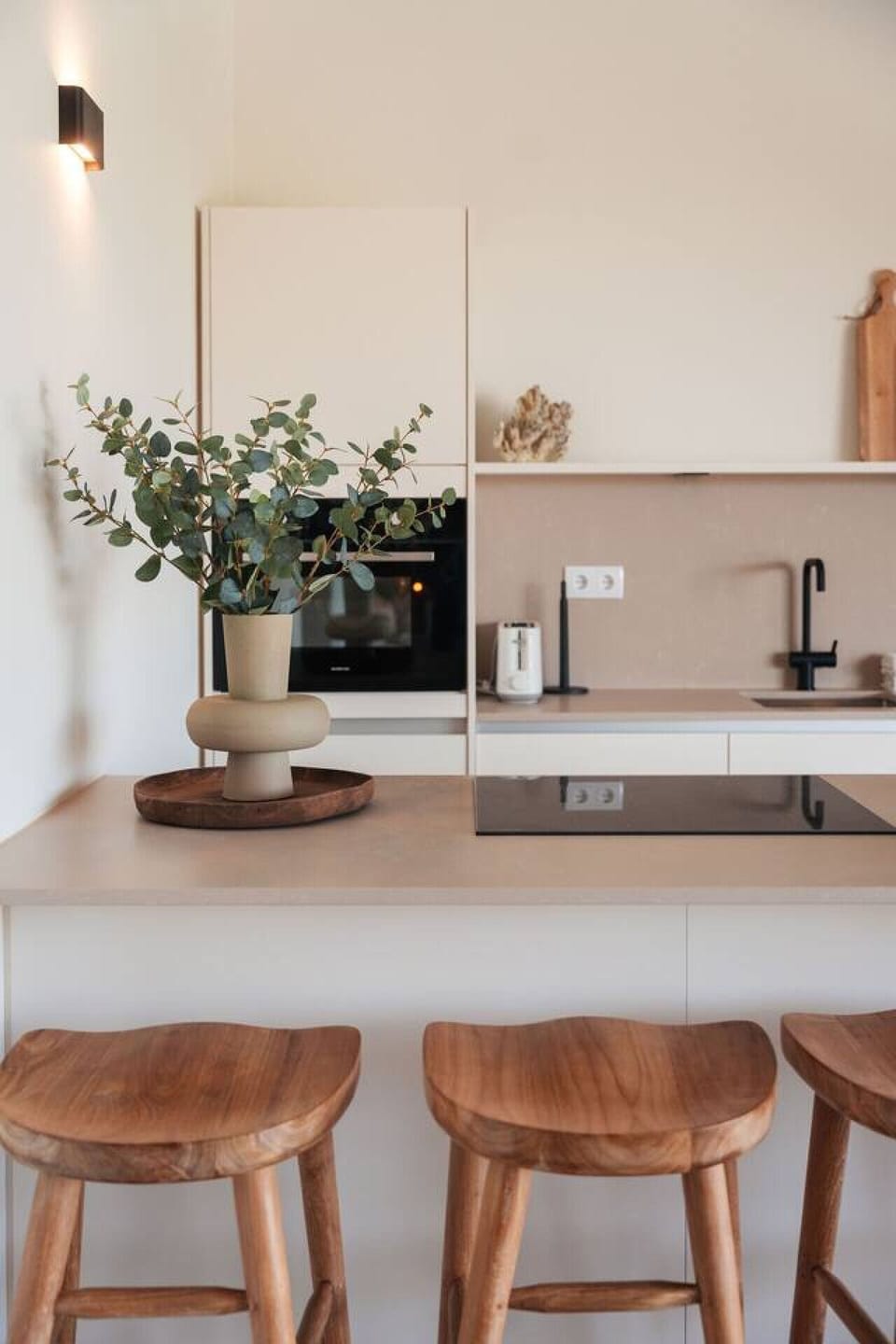Stylish kitchen with a breakfast bar—perfect for coffee, snacks, or casual meals.