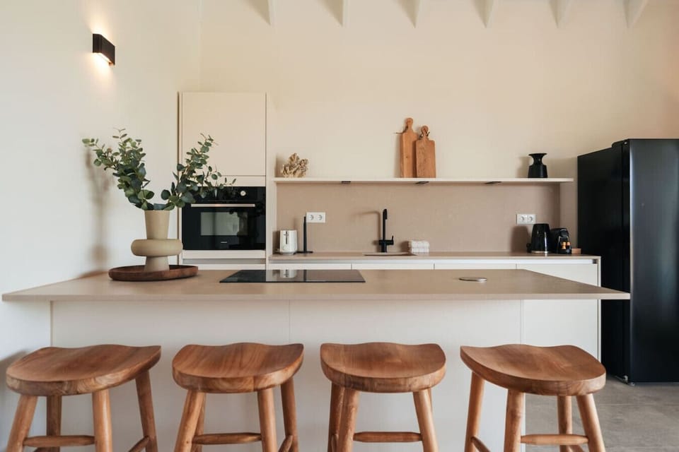 Enjoy cooking in this stylish kitchen with comfortable bar seating.