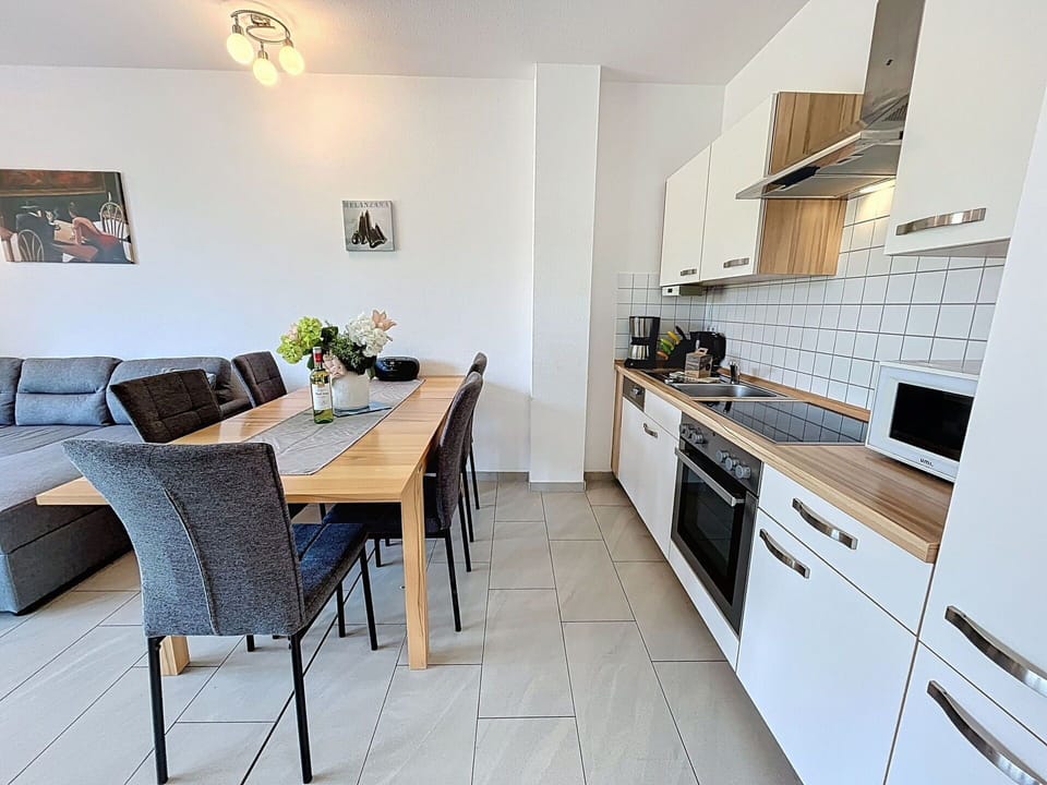 Furniture, Flooring, Interior Design, Wood, Floor, Countertop, Kitchen & Dining Room Table, Kitchen, Room, Wood Flooring
