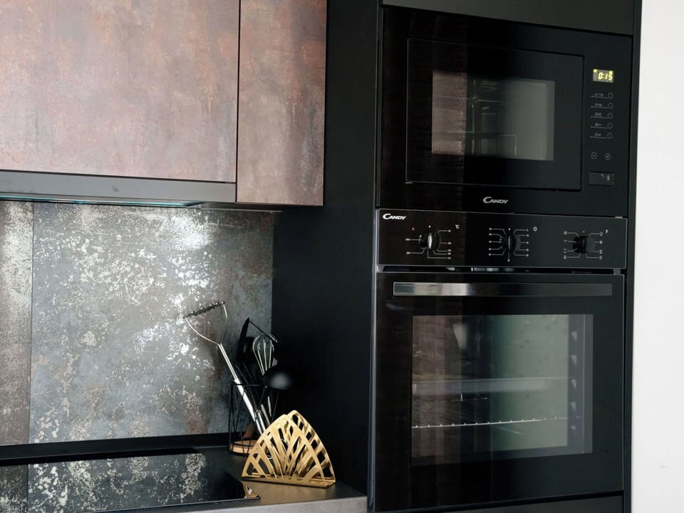 Interior Design, Flooring, Kitchen Appliance, Cabinetry, Home Appliance, Major Appliance, Cupboard, Room, Wood Stain, Kitchen