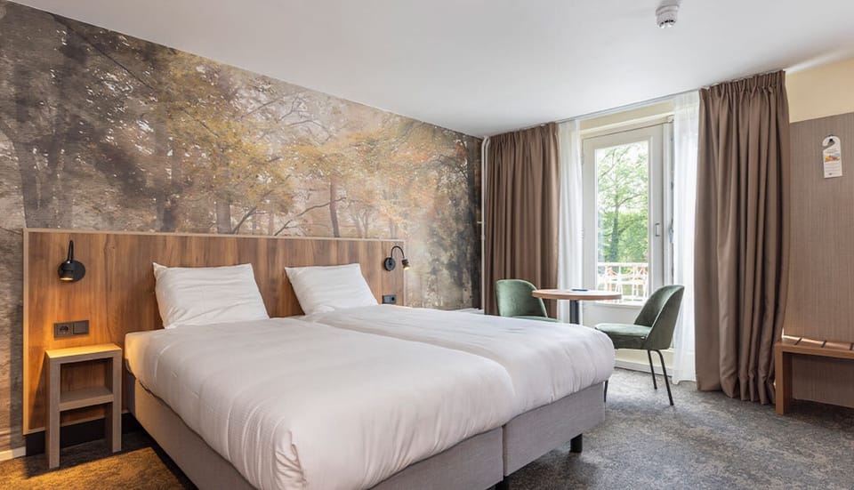 Wake up to soft daylight beside comfortable twin beds.