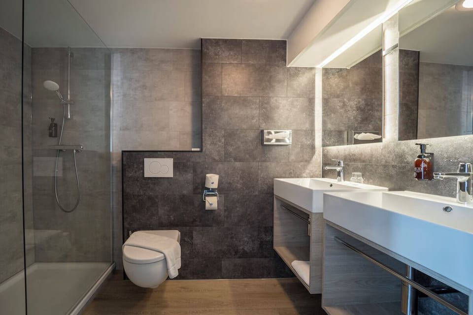 Refresh in a sleek bathroom with walk-in shower.
