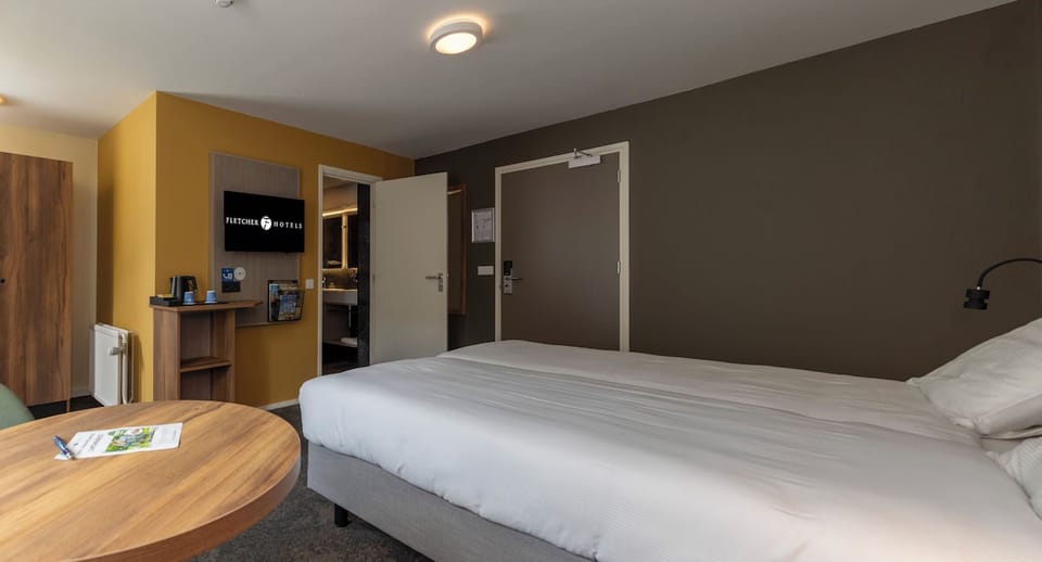 Settle in comfortably with TV, wardrobe, and kettle station.