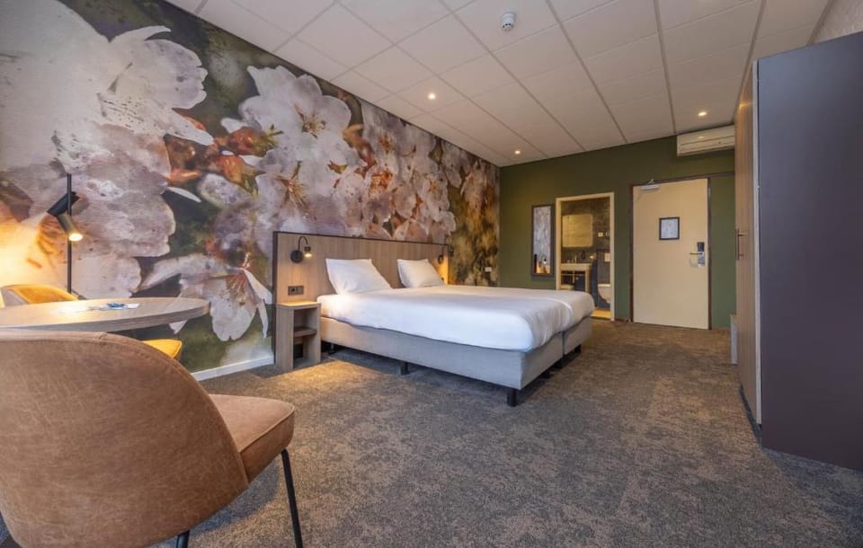 Lounge comfortably in a roomy suite with warm ambient lighting.