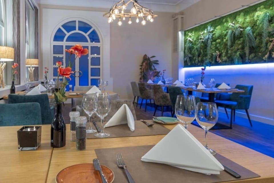 Savor relaxed dining in an elegant room with warm lighting.