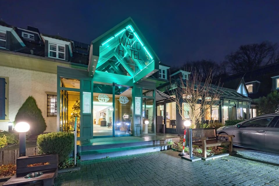Arrive in style under glowing signage and welcoming lights.