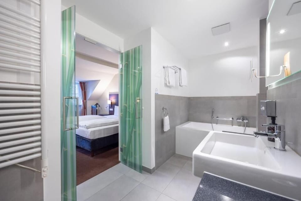 Indulge in a sleek bathroom with generous counter space.