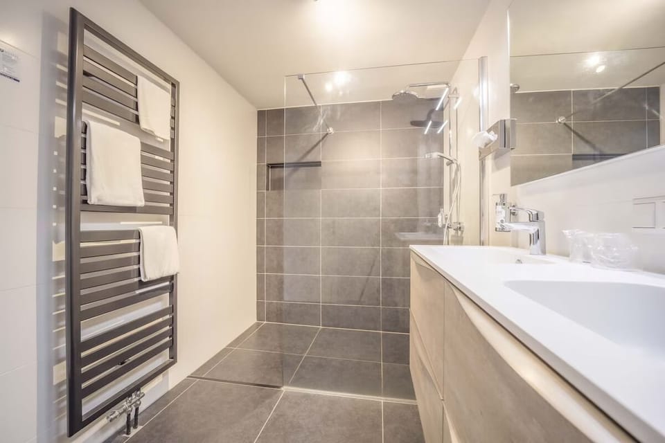 Enjoy a pampering routine with double sinks and warm towels.