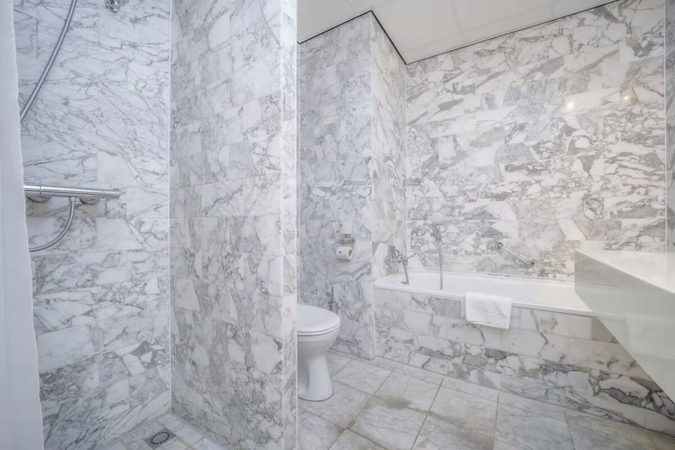 Start the day with a bright shower in a spotless bath.