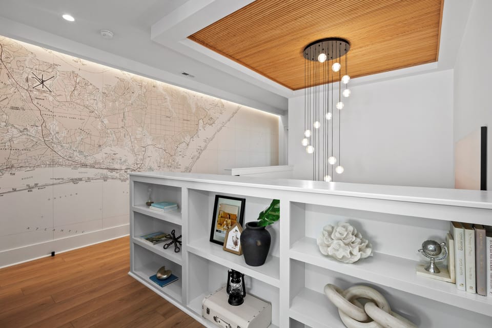 Discover your private retreat with custom built-in storage and stunning cascading lights creating the perfect ambiance for relaxation.